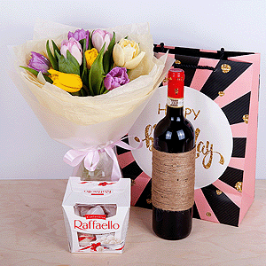 Yellow tulip - 4, Pink tulip - 4, Lilac tulip - 6, Tulip white - 3, Wrapping Paper, Ribbon, Non-alcoholic champagne or wine, Box of candies «Raffaello» 150 g, Present bag