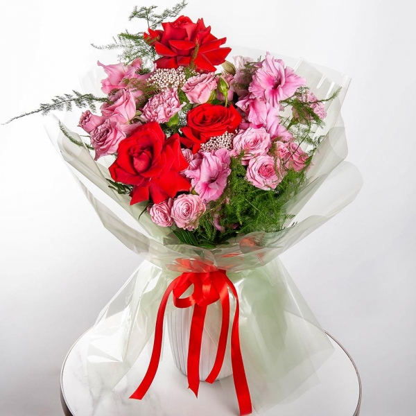 Red rose Nina 50 cm - 5, Spray rose: white, cream, light pink 50 cm - 4, Pink Gladiolus - 3, Pink Lisianthus (Eustoma) - 3, Pink carnation - 3, Ozotamnus, Asparagus setaceus (1 pc.), Wrapping Paper