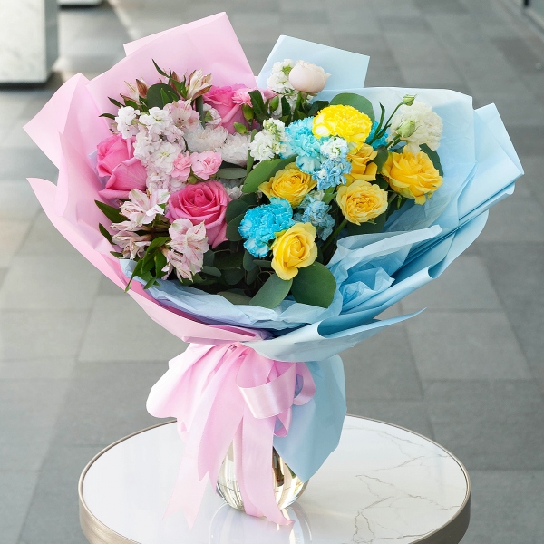 Rose Pink 50 cm Ecuador (Chelo, Hermosa, Novia, Titanik, Engagement, Pink Mondiale) - 5, Blue carnation - 4, Alstromeria white, soft pink - 4, White Matthiola - 2, Pink Matthiola - 3, Spray rose: yellow, orange 50 cm - 3, Baltica White Spray Chrysanthemum - 1, Pink spray carnation - 2, lisianthus - 2, Yellow carnation - 3, Eucalyptus populus (1 pc.), Wrapping Paper