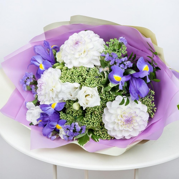 White Dahlia - 5, lisianthus - 4, Irises - 4, Sedum, Pittosporum, Pistachio, Wrapping Paper