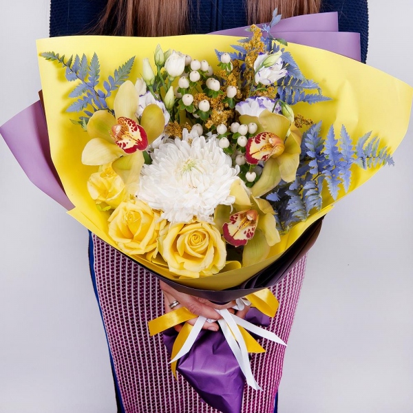 Magnum White Chrysanthemum - 1, Orchid bud yellow/brown Cymbidium - 3, Purple Lisianthus (Eustoma) - 3, Yellow rose 50 cm - 4, Flask for orchids, Hypericum, Solidago (1 pc.), Fern (1 pc.), Wrapping Paper