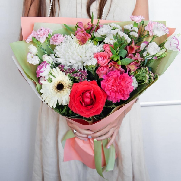 Magnum White Chrysanthemum - 1, Gerbera white - 1, Pink carnation - 2, Santini White Spray Chrysanthemum - 3, Bright pink spray rose mix, 50 cm - 2, Alstromeria white, soft pink - 3, Red rose 50 cm - 2, Pink Lisianthus (Eustoma) - 2, Pink spray carnation - 2, Ozotamnus, White statice, Pistachio, Wrapping Paper